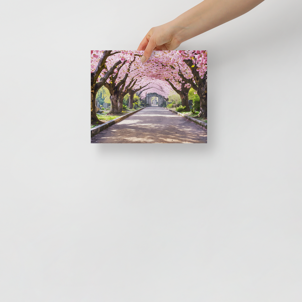 Hand holding a canvas print of a cherry blossom tree-lined path.